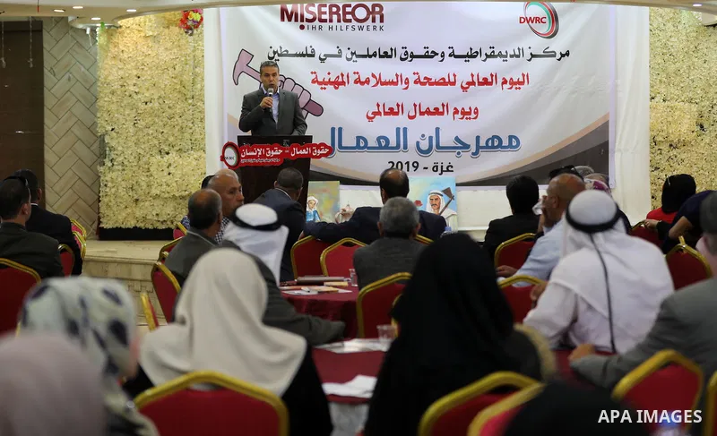 Palestinians attend a celebration marking the International Labour Day, in Gaza city on April 30, 2019. Labour Day is an annual holiday to celebrate the achievements of workers. Labour Day has its origins in the labour u...