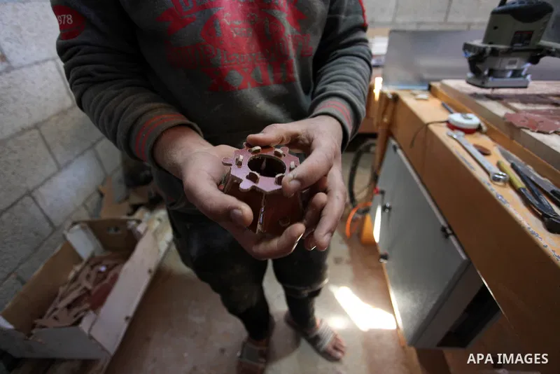 A Palestinian man works on a CNC machine as he manufactures traditional lanterns known in Arabic as "Fanous" on the holy month of Ramadan in Gaza city, on May 9, 2019. Ramadan is sacred to Muslims because it is during th...