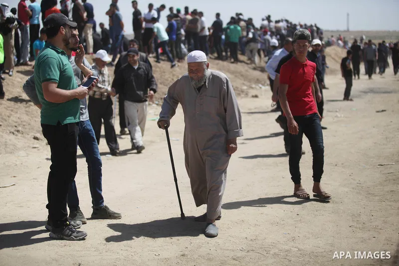 Palestinian demonstrators gather during a protest marking 71th anniversary of Nakba also known as Day of the Catastrophe in 1948, near the border fence east of Gaza City in the Gaza Strip on May 15, 2019. Photo by Mahmou...