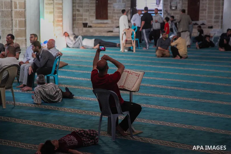 Muslim Palestinians read verses from the Koran at al-Omari mosque, during the Islamic holy month of Ramadan, in Gaza city on 19 May 2019. Muslims around the world celebrate the holy month of Ramadan by praying during the...