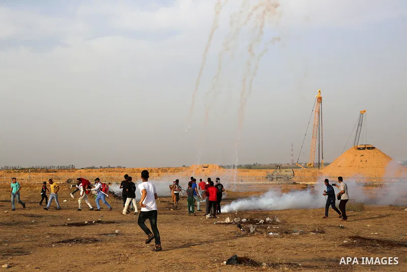 Palestinian protesters clash with Israeli troops following the tents protest where Palestinians demand the right to return to their homeland at the Israel-Gaza border, in Khan Younis in the southern Gaza Strip, May 23, 2...