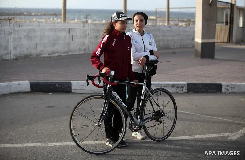 Palestinian cyclist girls ride bicycles during a sport cycling training, organized by the Palestinian Triathlon Federation in Gaza city, on May 26, 2019. Photo by Mahmoud Ajjour