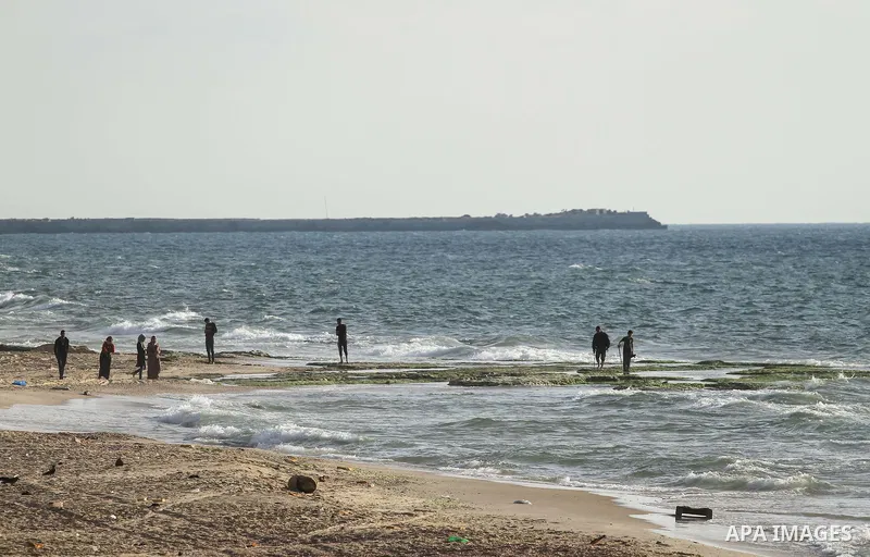 Palestinians ejoy swimming at the beach in Dair Al Balah in the center of Gaza strip on May 27, 2019. Photo by Mahmoud Khattab