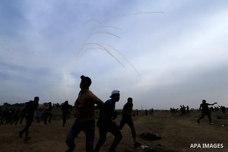 Palestinian protesters clash with Israeli troops following the tents protest where Palestinians demand the right to return to their homeland at the Israel-Gaza border, in the central Gaza Strip, May 31, 2019. Photo by Ma...