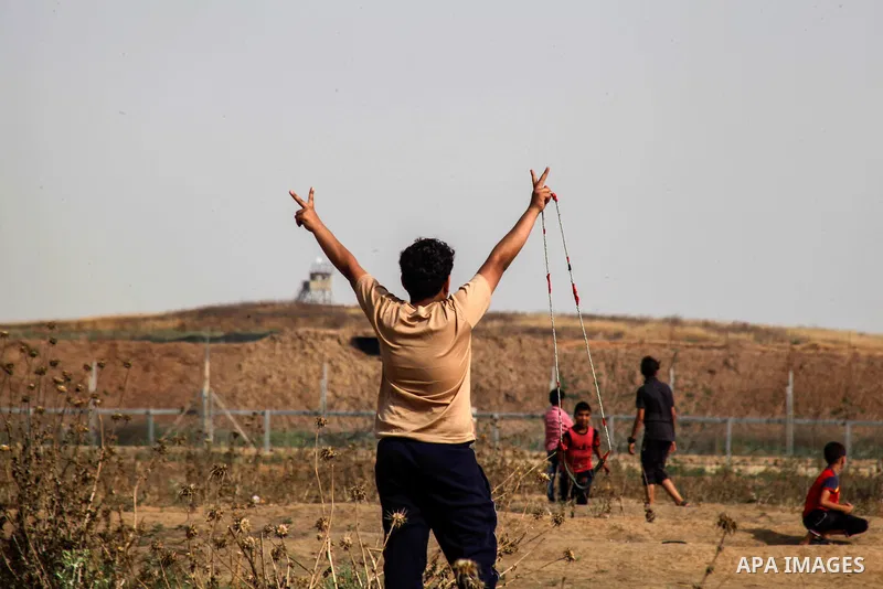 Palestinian protesters clash with Israeli troops following the tents protest where Palestinians demand the right to return to their homeland at the Israel-Gaza border, in Janalia in the northern Gaza Strip, May 31, 2019....