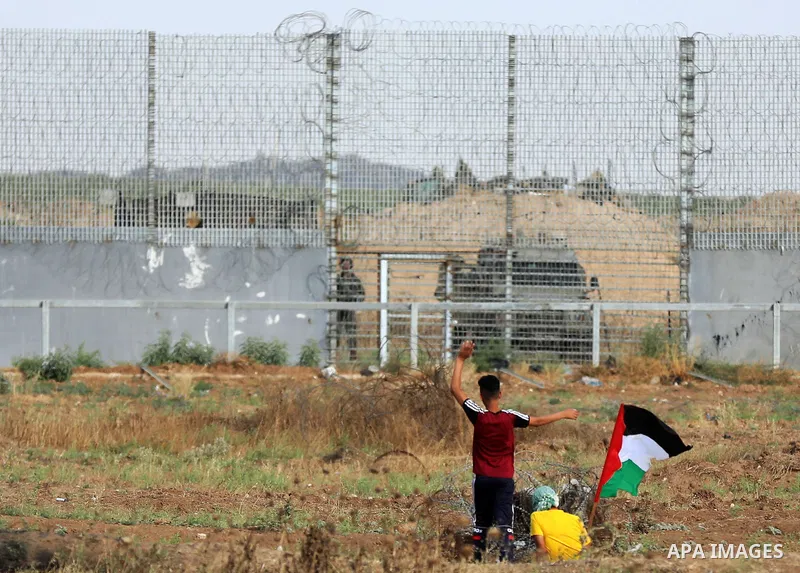 Palestinian protesters clash with Israeli troops following the tents protest where Palestinians demand the right to return to their homeland at the Israel-Gaza border, east of Gaza city, May 31, 2019. Photo by Mahmoud Na...
