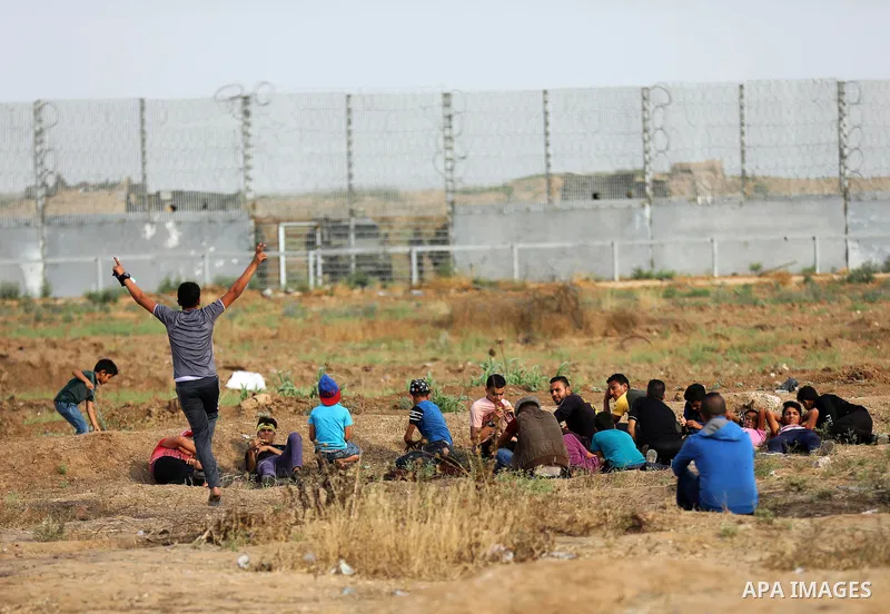 Palestinian protesters clash with Israeli troops following the tents protest where Palestinians demand the right to return to their homeland at the Israel-Gaza border, east of Gaza city, May 31, 2019. Photo by Mahmoud Na...