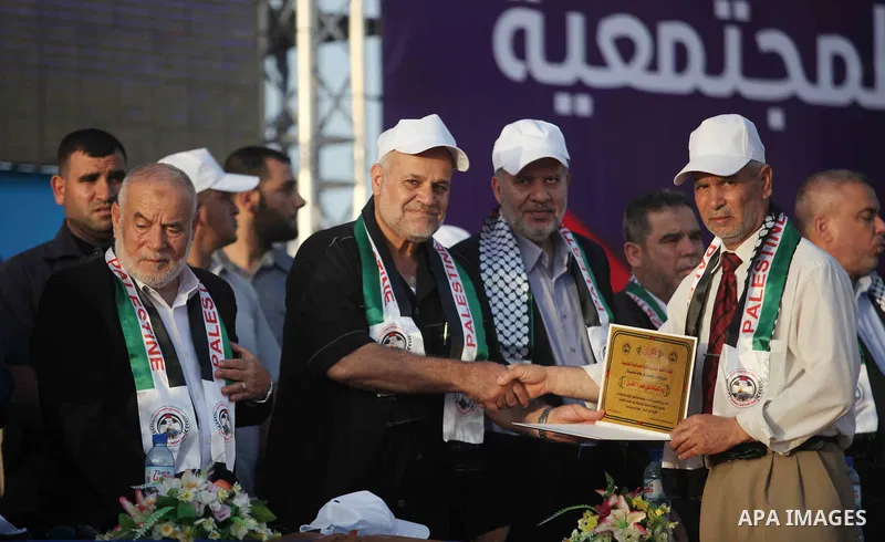 Palestinians attend a community reconciliation festival, in Gaza city, on June 20, 2019. The Committee for Community Reconciliation decided to spend $50,000 for the families of martyrs of the political division. Photo by...