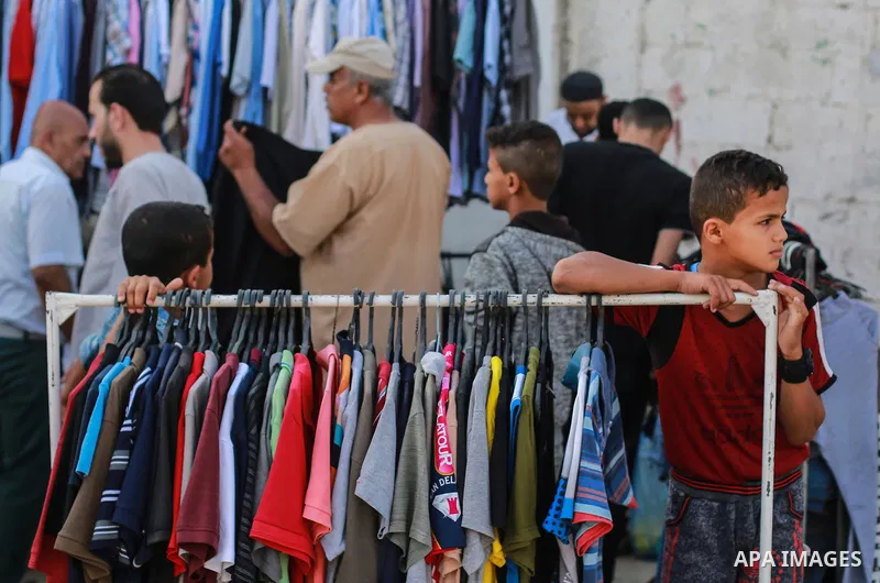 A picture taken on May 30, 2019, shows Palestinian vendors display second hand goods at a public market in Gaza city. Due to the current economic situation in Gaza Strip, many of the Palestinians resort to meet their nee...
