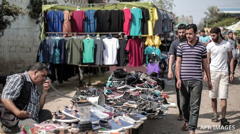 A picture taken on May 30, 2019, shows Palestinian vendors display second hand goods at a public market in Gaza city. Due to the current economic situation in Gaza Strip, many of the Palestinians resort to meet their nee...
