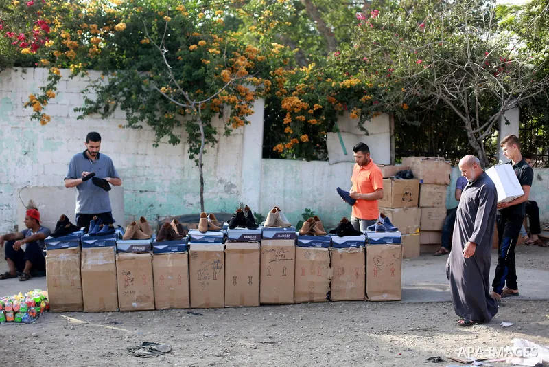 A picture taken on May 30, 2019, shows Palestinian vendors display second hand goods at a public market in Gaza city. Due to the current economic situation in Gaza Strip, many of the Palestinians resort to meet their nee...