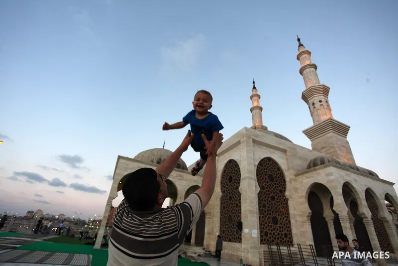 Palestinians enjoy at the beach along the shore of the Mediterranean Sea during the sunset, in Gaza City July 05, 2019. Photo by Mahmoud Ajjour