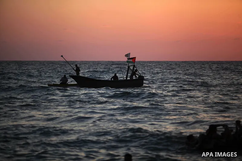 Palestinians enjoy at the beach along the shore of the Mediterranean Sea during the sunset, in Gaza City July 05, 2019. Photo by Mahmoud Ajjour
