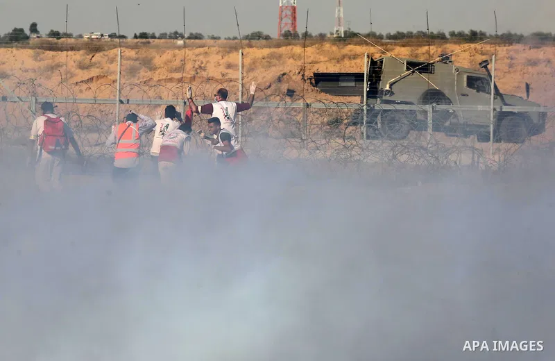 A wounded Palestinian protester is evacuated during clashes with Israeli troops following the tents protest where Palestinians demand the right to return to their homeland at the Israel-Gaza border, in Khan Younis in the...