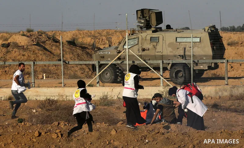 A wounded Palestinian protester is evacuated during clashes with Israeli troops following the tents protest where Palestinians demand the right to return to their homeland at the Israel-Gaza border, in Khan Younis in the...