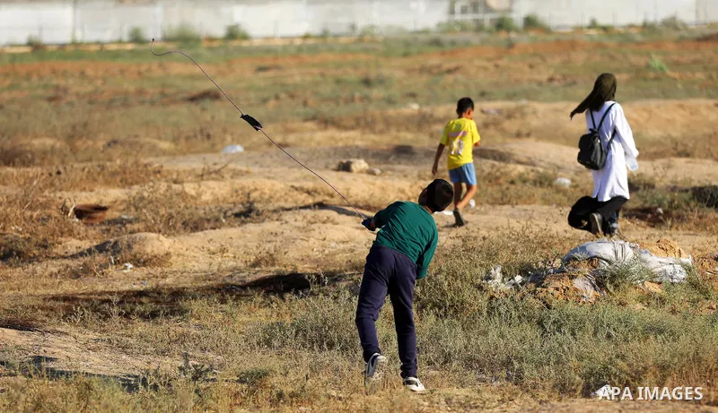 Palestinian protesters clash with Israeli troops following the tents protest where Palestinians demand the right to return to their homeland at the Israel-Gaza border, east of Gaza city, July 05, 2019. Photo by Mahmoud N...