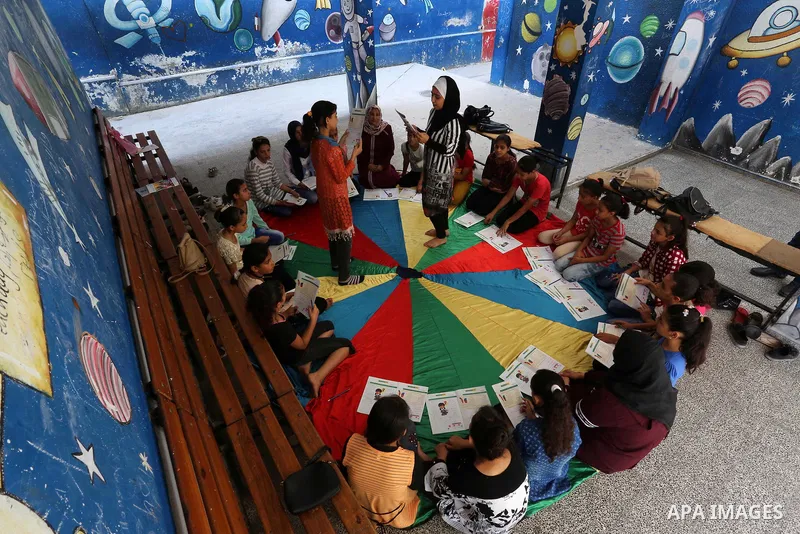 Palestinian girls play at a summer camp run by the United Nations Relief and Works Agency (UNRWA) in Gaza City on July 08, 2019. the UNRWA Summer Games programme provides the children of Gaza with a rare opportunity to m...