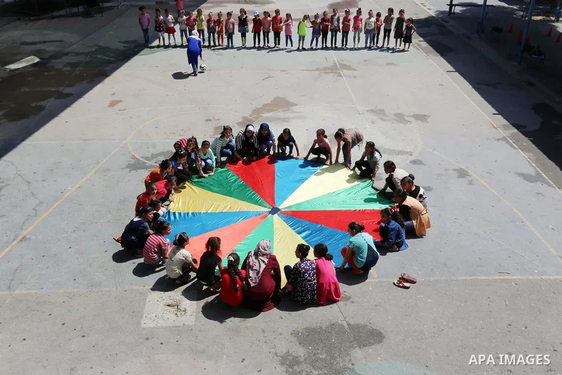 Palestinian girls play at a summer camp run by the United Nations Relief and Works Agency (UNRWA) in Gaza City on July 08, 2019. the UNRWA Summer Games programme provides the children of Gaza with a rare opportunity to m...