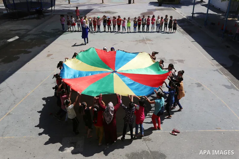 Palestinian girls play at a summer camp run by the United Nations Relief and Works Agency (UNRWA) in Gaza City on July 08, 2019. the UNRWA Summer Games programme provides the children of Gaza with a rare opportunity to m...