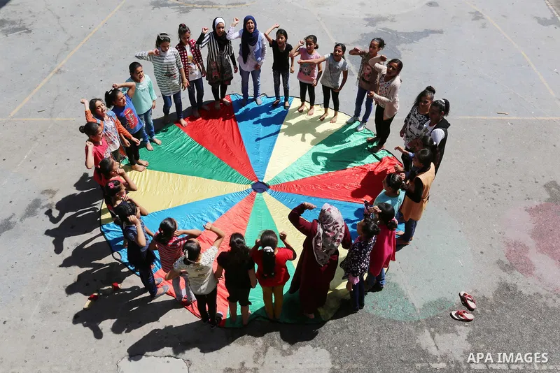 Palestinian girls play at a summer camp run by the United Nations Relief and Works Agency (UNRWA) in Gaza City on July 08, 2019. the UNRWA Summer Games programme provides the children of Gaza with a rare opportunity to m...