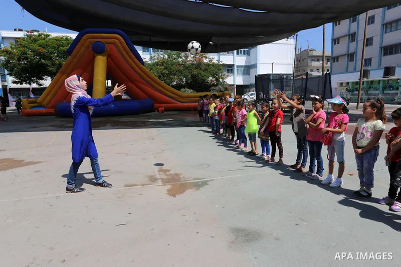 Palestinian girls play at a summer camp run by the United Nations Relief and Works Agency (UNRWA) in Gaza City on July 08, 2019. the UNRWA Summer Games programme provides the children of Gaza with a rare opportunity to m...