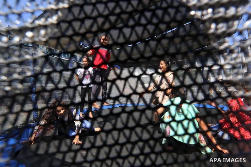 Palestinian girls play at a summer camp run by the United Nations Relief and Works Agency (UNRWA) in Gaza City on July 08, 2019. the UNRWA Summer Games programme provides the children of Gaza with a rare opportunity to m...