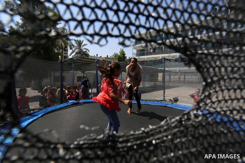 Palestinian girls play at a summer camp run by the United Nations Relief and Works Agency (UNRWA) in Gaza City on July 08, 2019. the UNRWA Summer Games programme provides the children of Gaza with a rare opportunity to m...