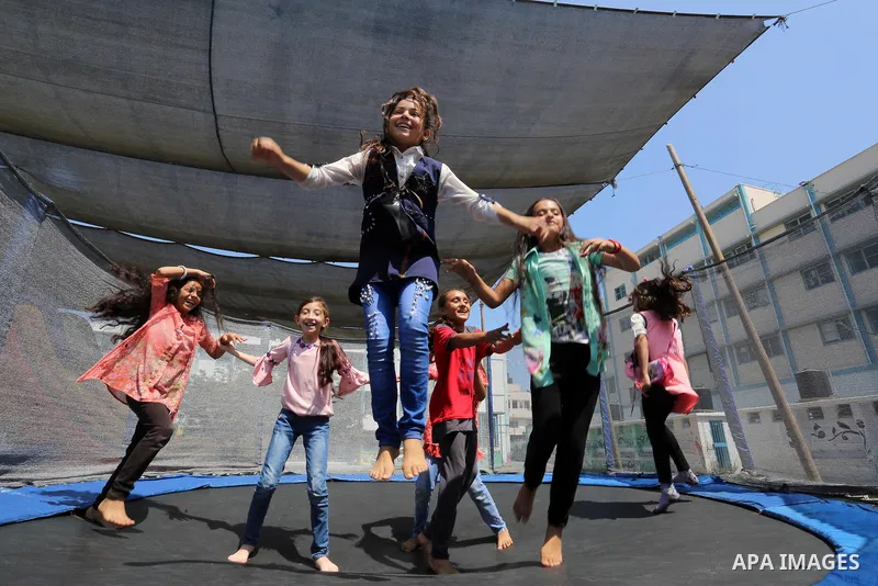 Palestinian girls play at a summer camp run by the United Nations Relief and Works Agency (UNRWA) in Gaza City on July 08, 2019. the UNRWA Summer Games programme provides the children of Gaza with a rare opportunity to m...