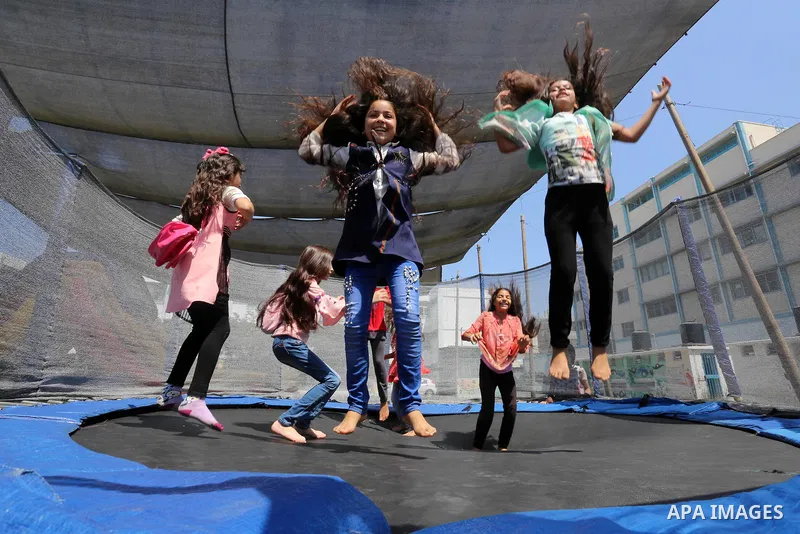 Palestinian girls play at a summer camp run by the United Nations Relief and Works Agency (UNRWA) in Gaza City on July 08, 2019. the UNRWA Summer Games programme provides the children of Gaza with a rare opportunity to m...