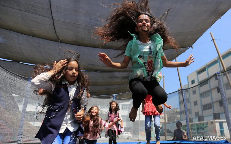 Palestinian girls play at a summer camp run by the United Nations Relief and Works Agency (UNRWA) in Gaza City on July 08, 2019. the UNRWA Summer Games programme provides the children of Gaza with a rare opportunity to m...