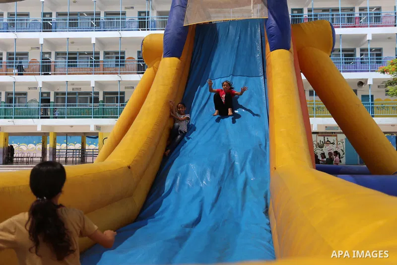 Palestinian girls play at a summer camp run by the United Nations Relief and Works Agency (UNRWA) in Gaza City on July 08, 2019. the UNRWA Summer Games programme provides the children of Gaza with a rare opportunity to m...