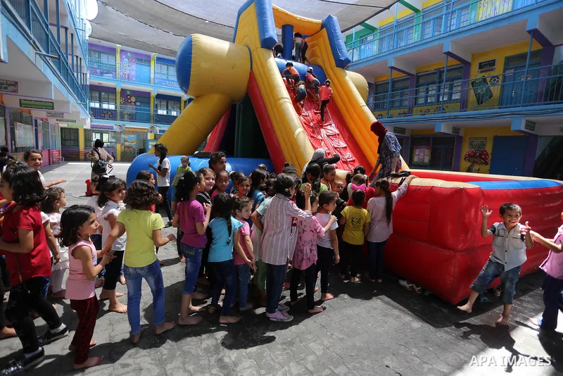 Palestinian girls play at a summer camp run by the United Nations Relief and Works Agency (UNRWA) in Gaza City on July 08, 2019. the UNRWA Summer Games programme provides the children of Gaza with a rare opportunity to m...