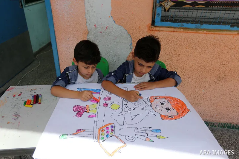 Palestinian girls play at a summer camp run by the United Nations Relief and Works Agency (UNRWA) in Gaza City on July 08, 2019. the UNRWA Summer Games programme provides the children of Gaza with a rare opportunity to m...