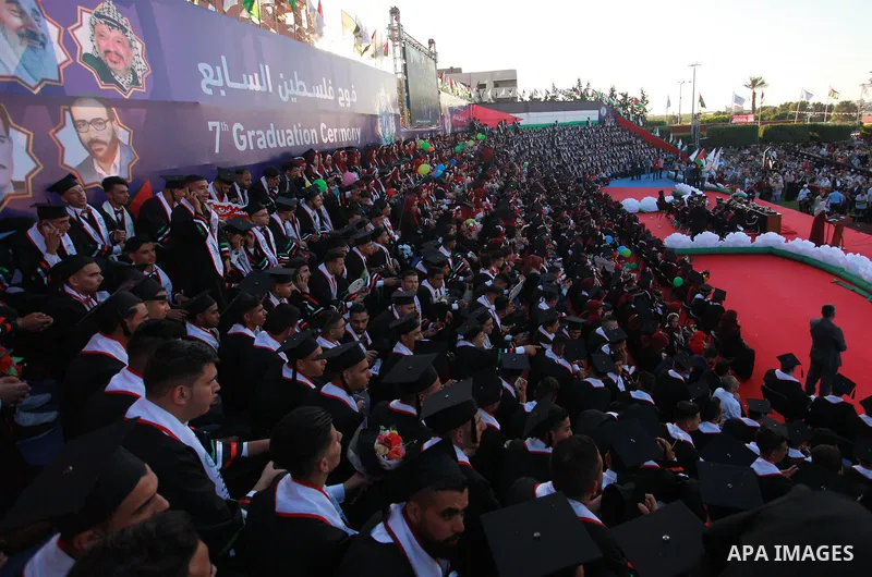 Palestinian students attend their graduation ceremony at the Palestine University in Gaza city, on July 13, 2019. Photo by Mahmoud Ajjour