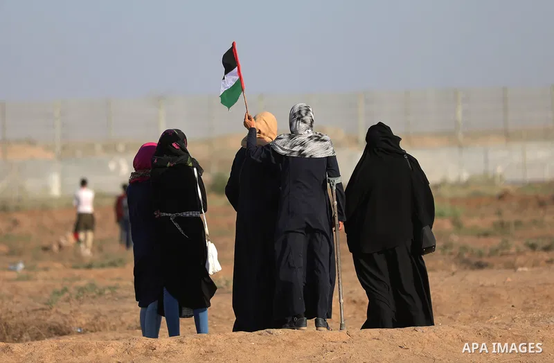 Palestinian protesters clash with Israeli troops following the tents protest where Palestinians demand the right to return to their homeland at the Israel-Gaza border, in the east of Gaza city, July 19, 2019. Photo by Ma...