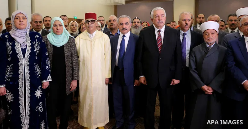Palestinian Prime Minister Mohammad Ishtayeh attends the ceremony marking the 20th anniversary of the Moroccan King Mohammed VI accession to the throne, at the Moroccan embassy, in the West Bank city of Ramallah, July 30...