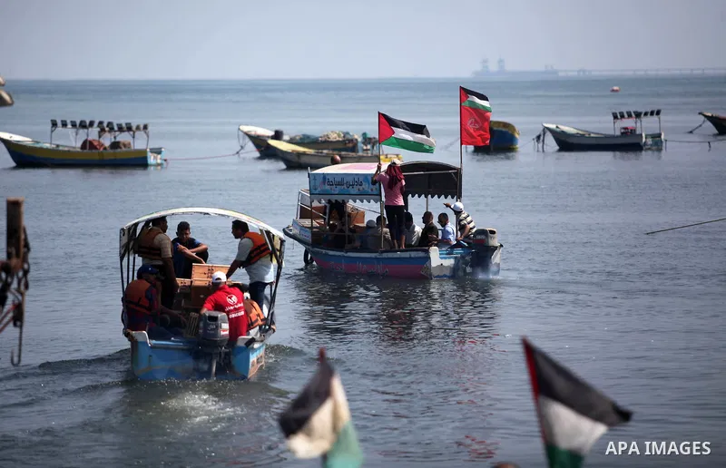 Palestinian men attend the homing pigeon racing at Gaza seaport, on August 1, 2019. Photo by Mahmoud Ajjour