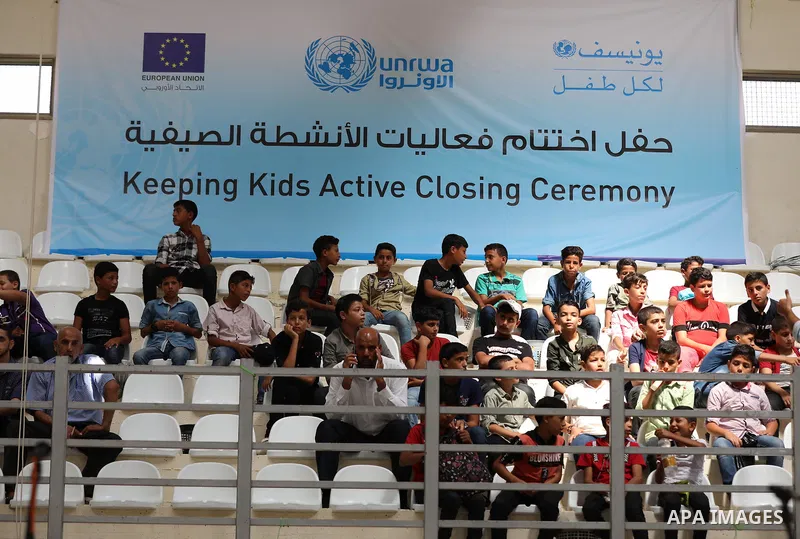 Palestinian children attend the closing ceremony of summer camps organized by the United Nations Relief and Works Agency (UNRWA), in the northern Gaza city, August 1, 2019. Summer camps last for five weeks, and offer a w...