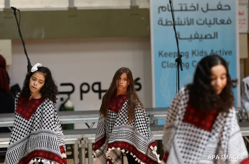 Palestinian children attend the closing ceremony of summer camps organized by the United Nations Relief and Works Agency (UNRWA), in the northern Gaza city, August 1, 2019. Summer camps last for five weeks, and offer a w...