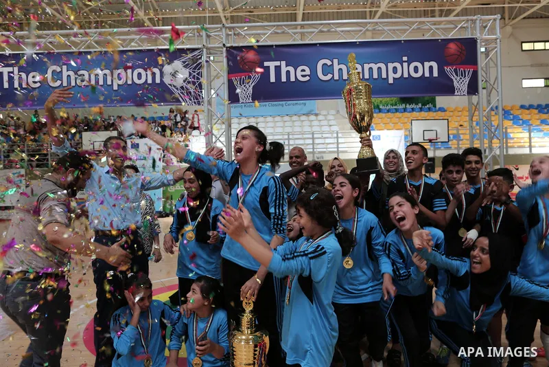 Palestinian children attend the closing ceremony of summer camps organized by the United Nations Relief and Works Agency (UNRWA), in the northern Gaza city, August 1, 2019. Summer camps last for five weeks, and offer a w...