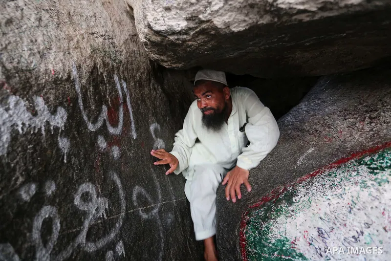 A Muslim pilgrim prays at Mount Al-Noor during the annual haj pilgrimage in Mecca, on August 6, 2019. Mount Al-Noor houses Ghar-E-Hira or Hira cave, where Prophet Mohammad is said to have spent a great deal of time in th...