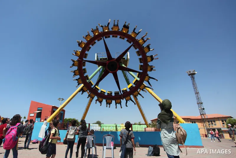 Palestinian children play at Sharm Park in Gaza city on August 06, 2019. Photo by Mahmoud Ajjour