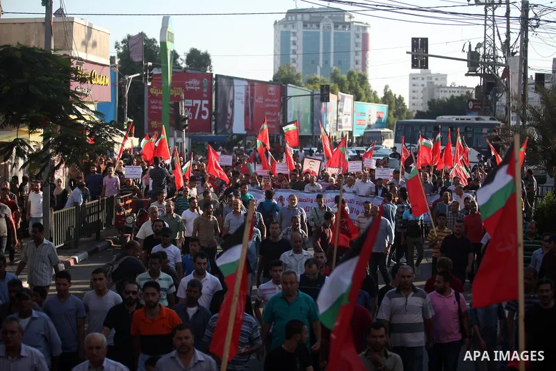 Protesters take part in a demonstration in solidarity with Palestinian refugees in Lebanon, and in solidarity with Palestinain prisoners in Israeli jails, in Gaza city on August 07, 2019. Protests over labour conditions...