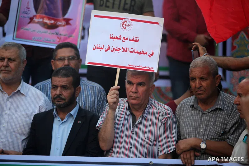 Protesters take part in a demonstration in solidarity with Palestinian refugees in Lebanon, and in solidarity with Palestinain prisoners in Israeli jails, in Gaza city on August 07, 2019. Protests over labour conditions...