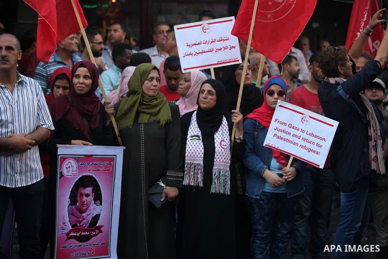 Protesters take part in a demonstration in solidarity with Palestinian refugees in Lebanon, and in solidarity with Palestinain prisoners in Israeli jails, in Gaza city on August 07, 2019. Protests over labour conditions...