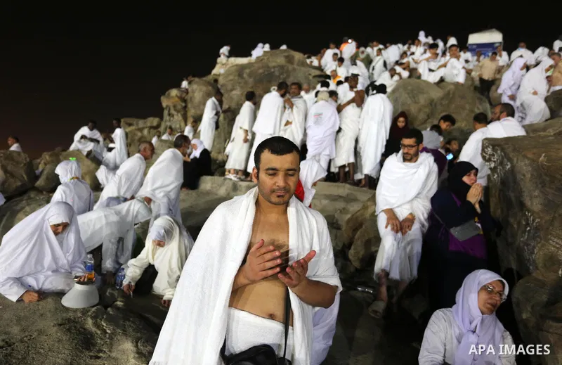 Muslim pilgrims pray on Mount Arafat, as Jabal al-Rahma near Mecca, as they take part in one of the Hajj rituals southeast of the Saudi holy city of Mecca on August 10, 2019. Arafat is the site where Muslims believe the...