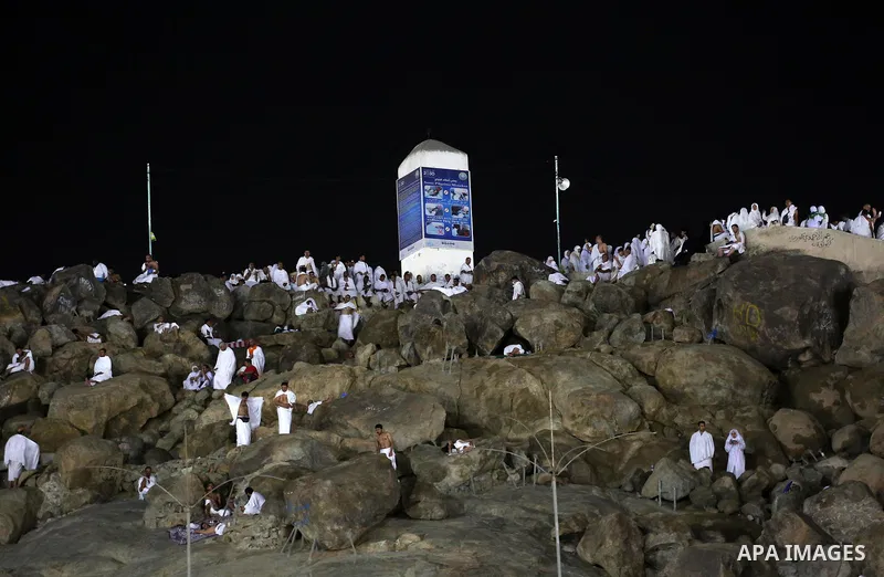 Muslim pilgrims pray on Mount Arafat, as Jabal al-Rahma near Mecca, as they take part in one of the Hajj rituals southeast of the Saudi holy city of Mecca on August 10, 2019. Arafat is the site where Muslims believe the...