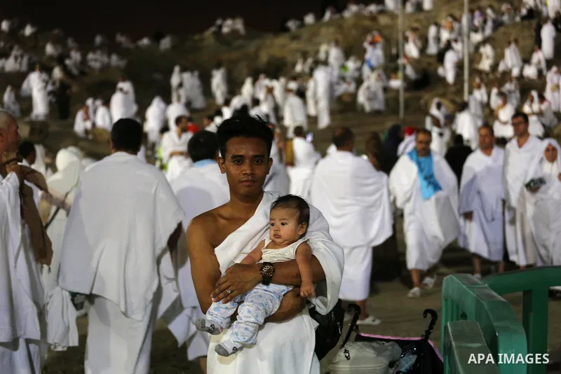 Muslim pilgrims pray on Mount Arafat, as Jabal al-Rahma near Mecca, as they take part in one of the Hajj rituals southeast of the Saudi holy city of Mecca on August 10, 2019. Arafat is the site where Muslims believe the...