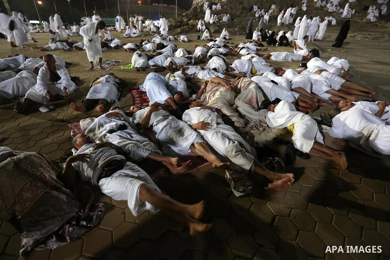 Muslim pilgrims pray on Mount Arafat, as Jabal al-Rahma near Mecca, as they take part in one of the Hajj rituals southeast of the Saudi holy city of Mecca on August 10, 2019. Arafat is the site where Muslims believe the...