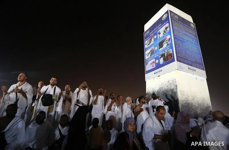 Muslim pilgrims pray on Mount Arafat, as Jabal al-Rahma near Mecca, as they take part in one of the Hajj rituals southeast of the Saudi holy city of Mecca on August 10, 2019. Arafat is the site where Muslims believe the...